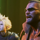 Final Fantasy VII Remake's Cloud and Barrett stand stunned with their jaws hanging open.